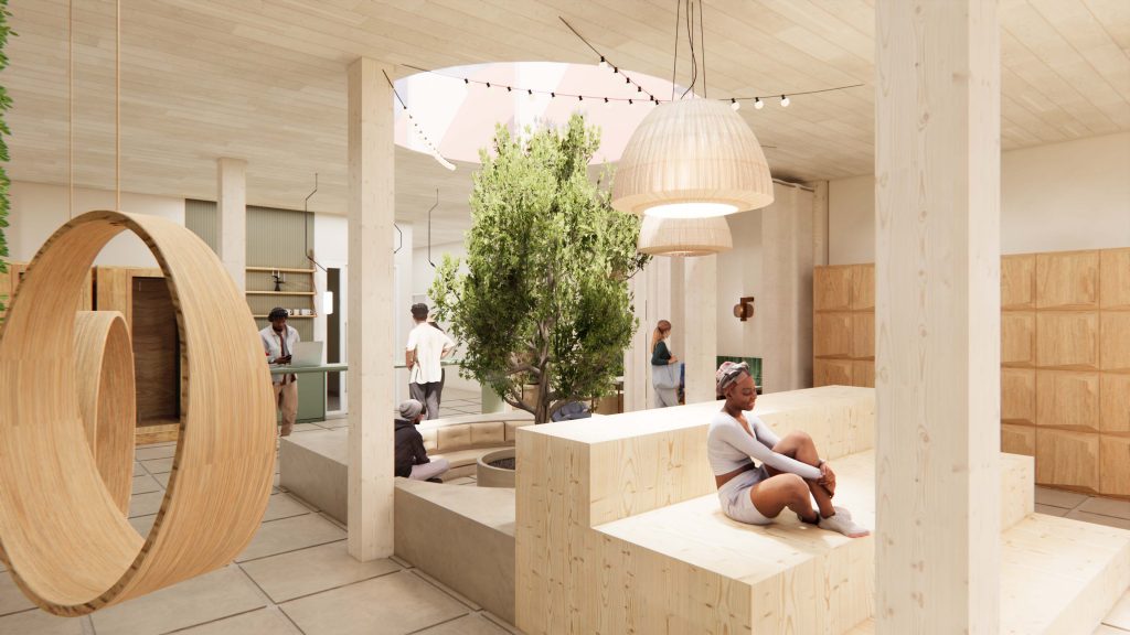 Innenarchitektur München - New Work Bürogestaltung, heller offener Bereich mit Pflanzen mitten im Raum