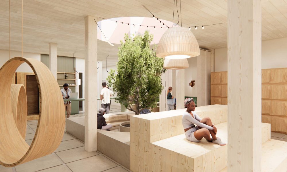 Innenarchitektur München - New Work Bürogestaltung, heller offener Bereich mit Pflanzen mitten im Raum